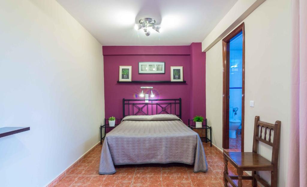 Postel nebo postele na pokoji v ubytování Hostal Jentoft