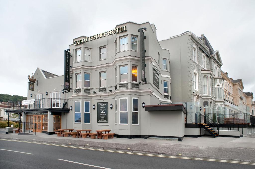 a large white building on the side of a street at Cabot Court Hotel Wetherspoon in Weston-super-Mare