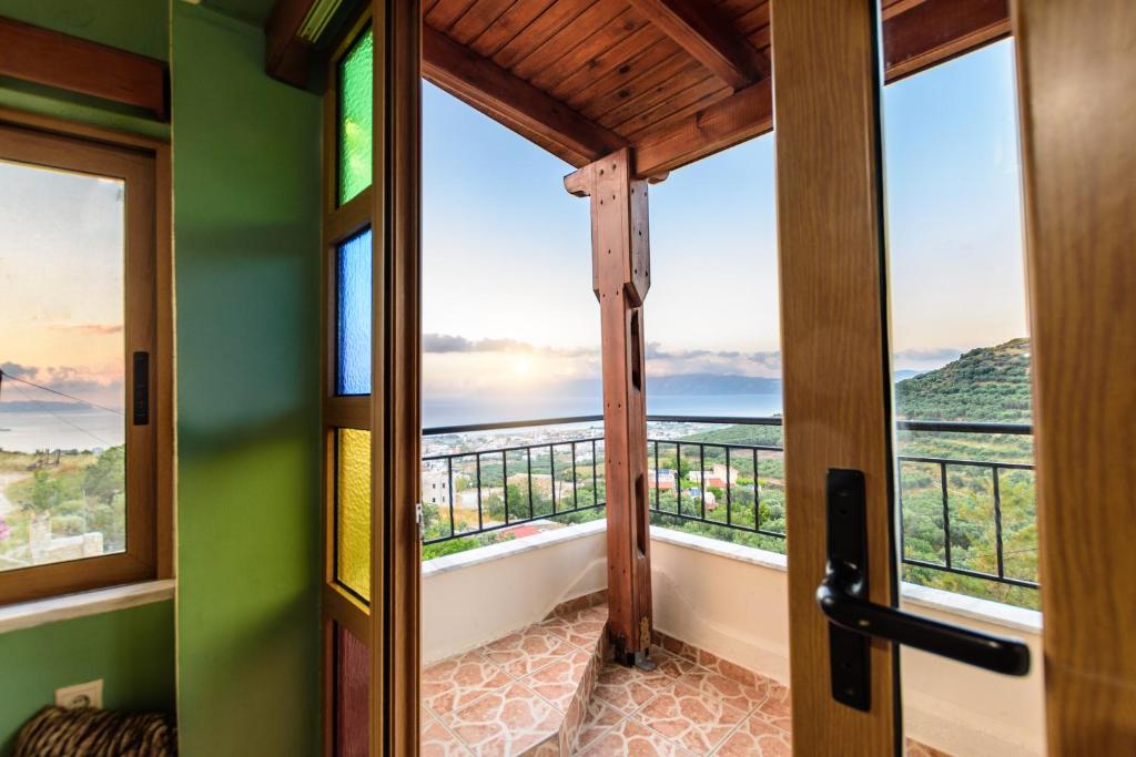 a room with a balcony with views of the ocean at Lilian View Studio in Kissamos