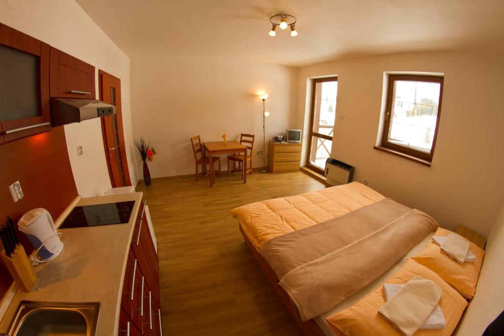 Postel nebo postele na pokoji v ubytování Holiday Resort Telgárt