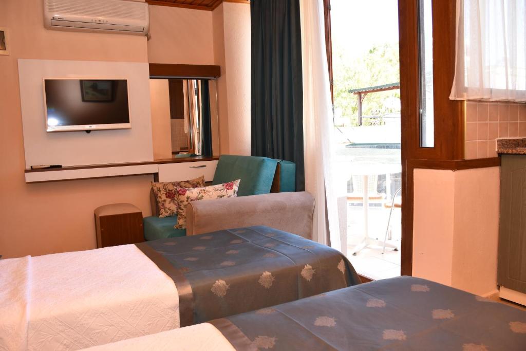Postel nebo postele na pokoji v ubytování Aybey Apart Hotel