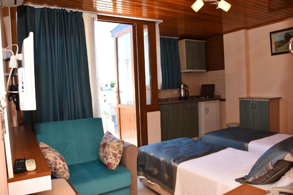 Postel nebo postele na pokoji v ubytování Aybey Apart Hotel