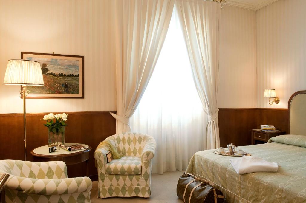 Postel nebo postele na pokoji v ubytování Grand Hotel Bastiani