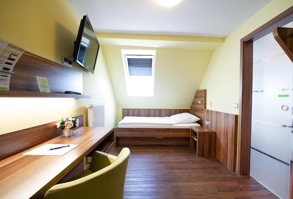 Postel nebo postele na pokoji v ubytování Hotel Meyer