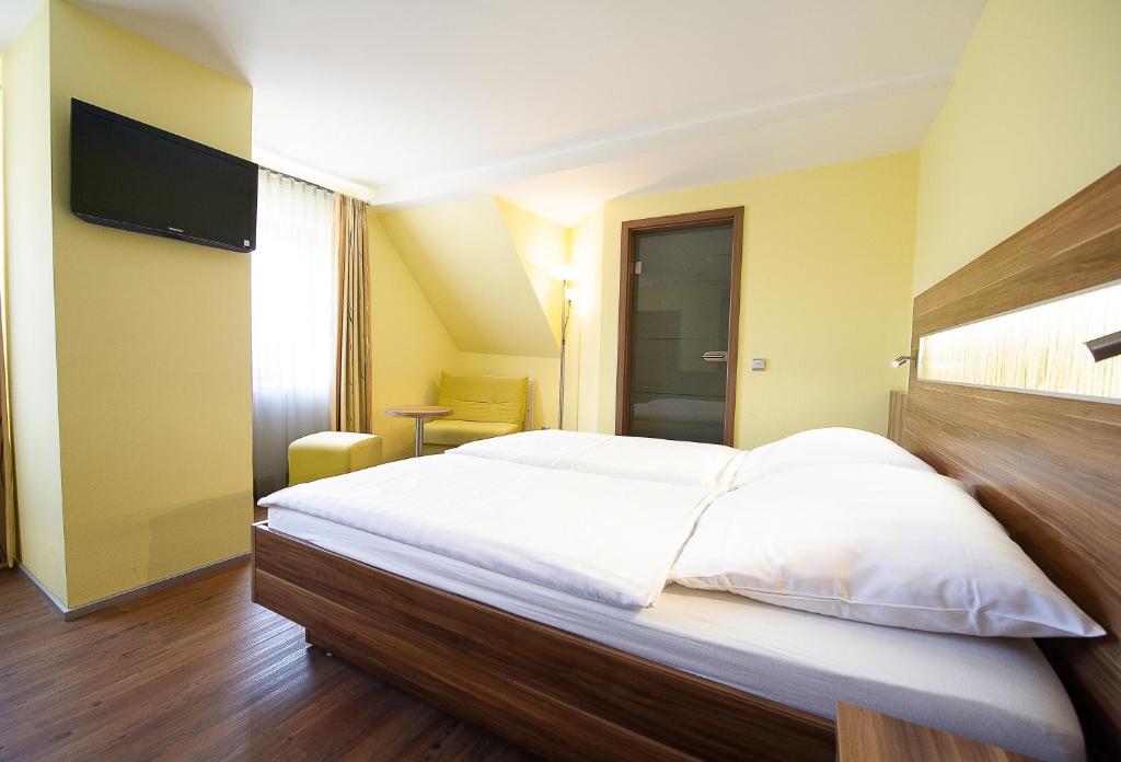 Postel nebo postele na pokoji v ubytování Hotel Meyer