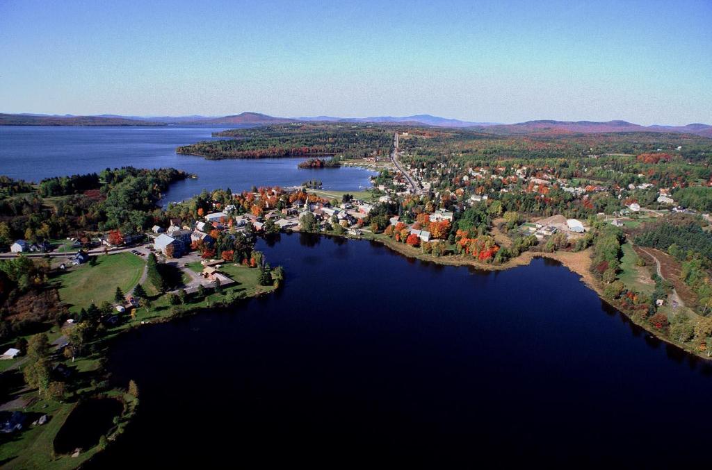 an aerial view of a town on a lake at Rangeley Saddleback Inn in Rangeley
