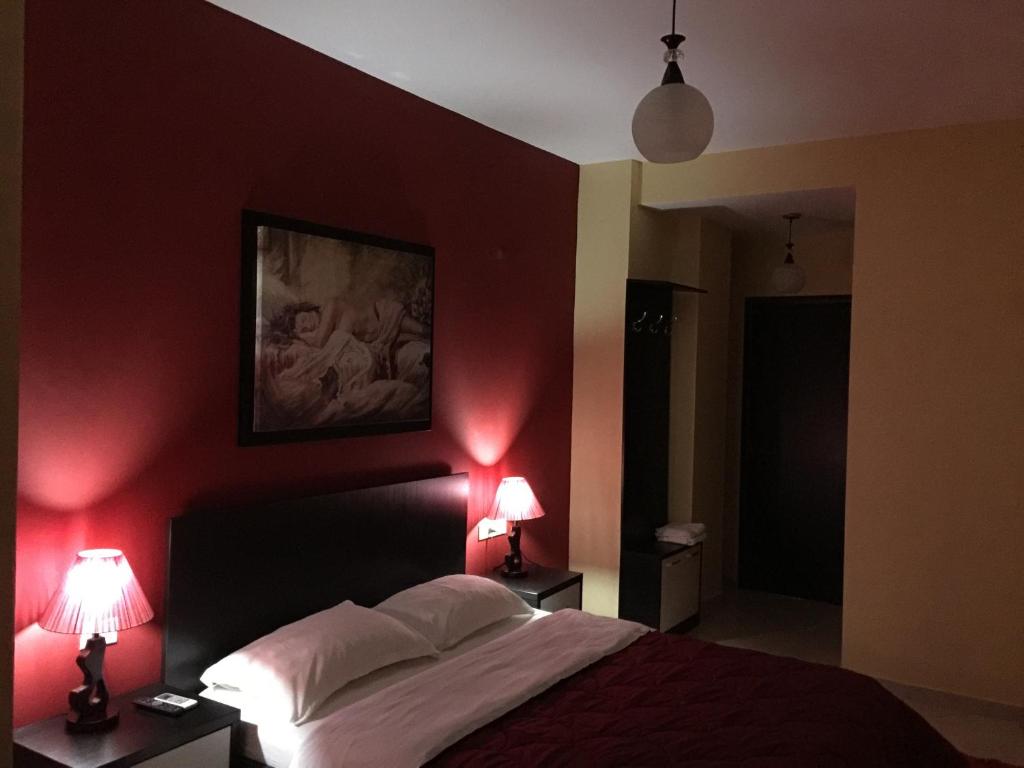 Postel nebo postele na pokoji v ubytování Haris Hotel