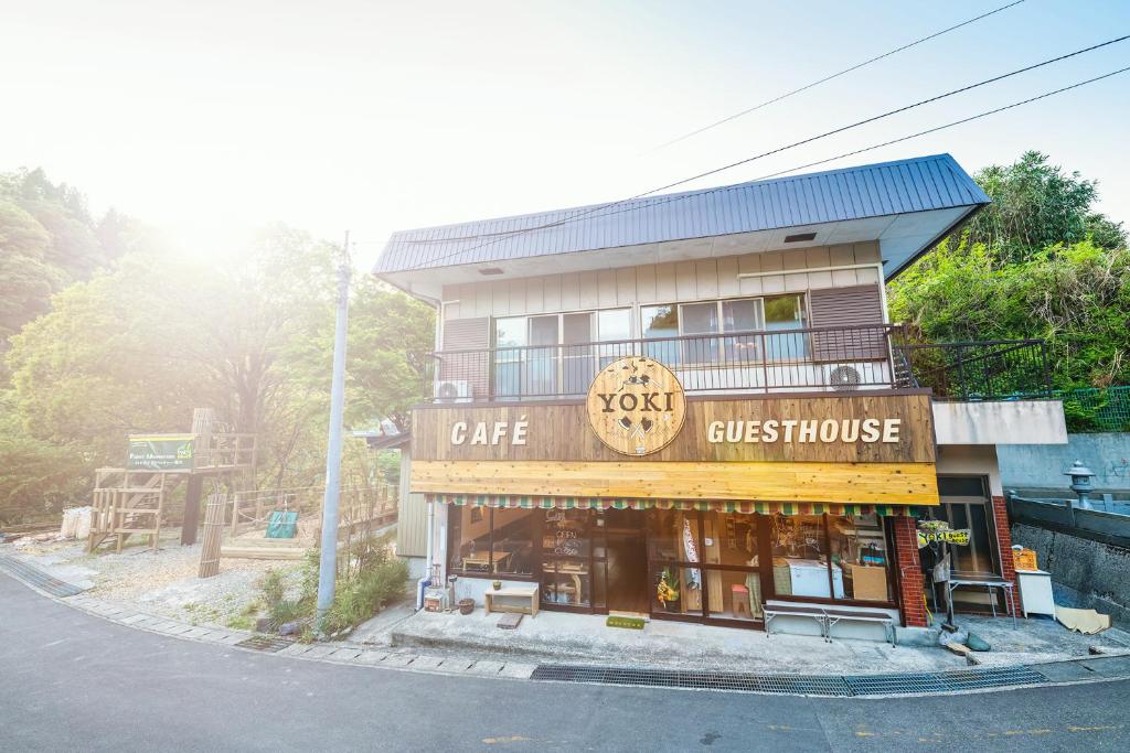 a building with a cafe and a guest house at YOKI Guest House in Miyoshi