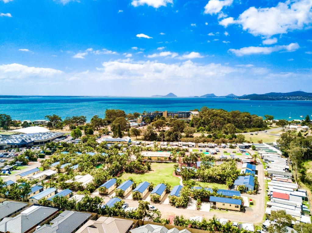 an aerial view of a resort with the ocean in the background at Ingenia Holidays Soldiers Point in Soldiers Point