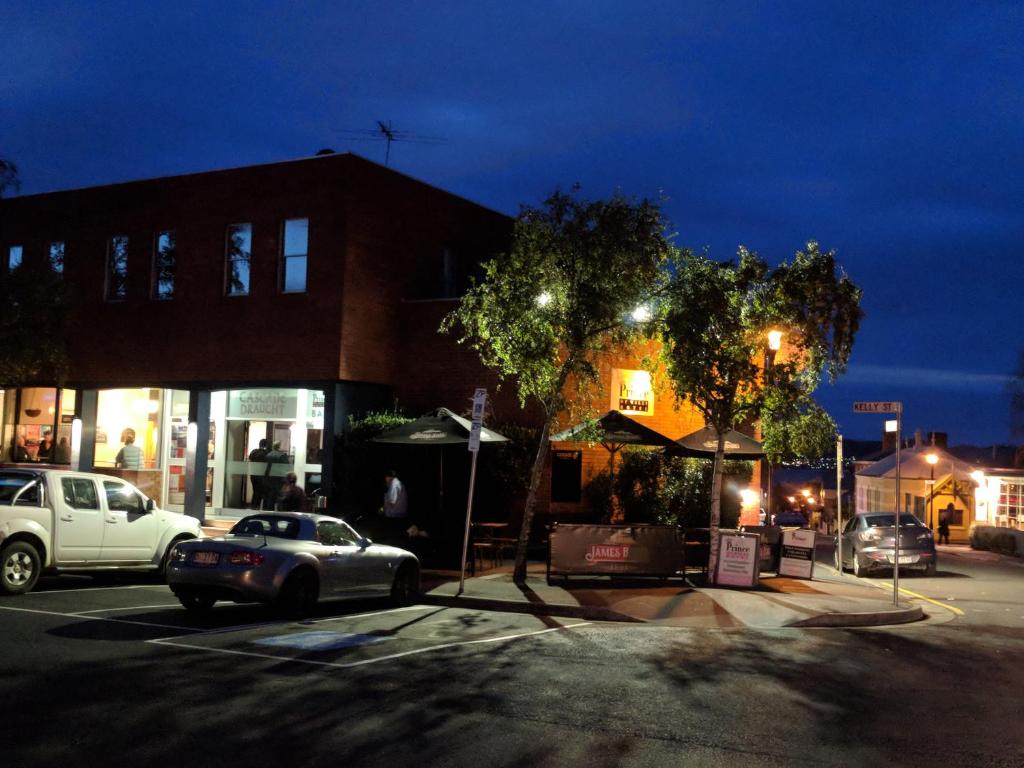 a car parked in a parking lot at night at Prince Of Wales Hotel in Hobart