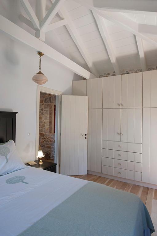 Postel nebo postele na pokoji v ubytování Limeni Villa