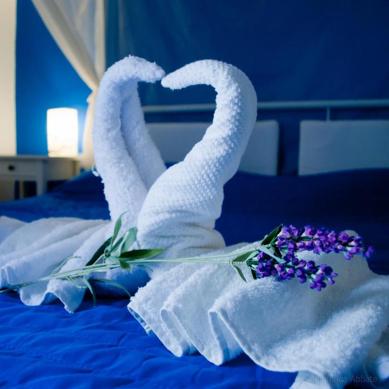 Postel nebo postele na pokoji v ubytování Affittacamere B&B Carella