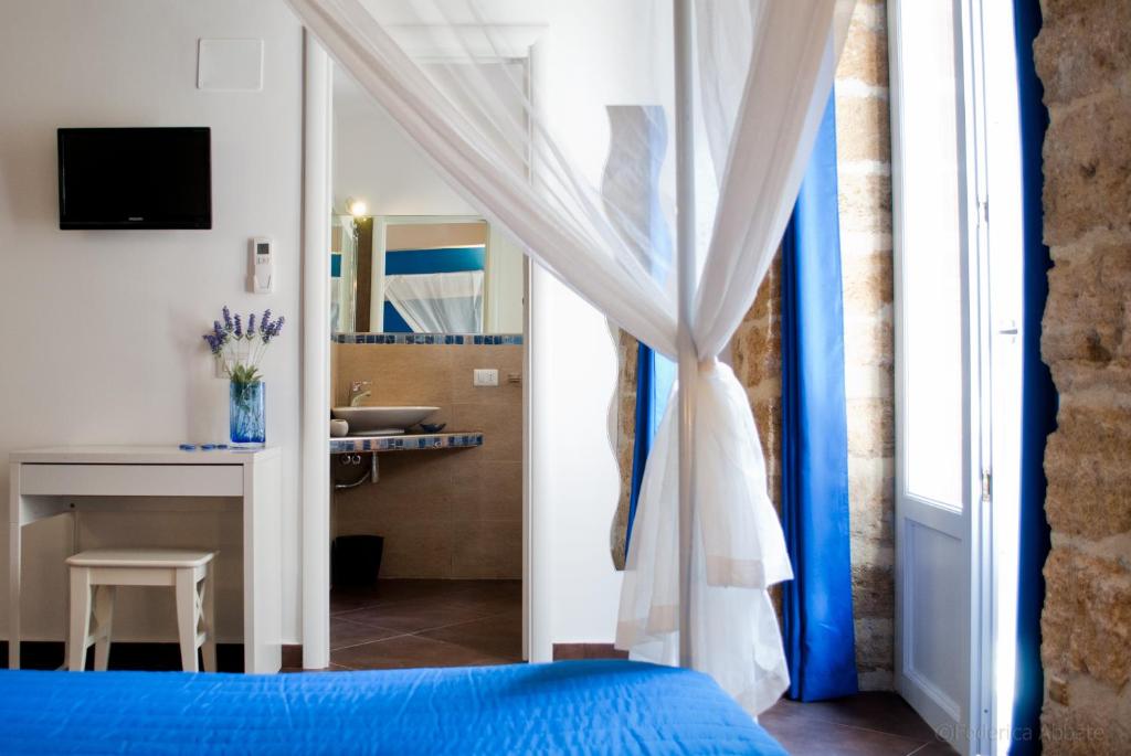Postel nebo postele na pokoji v ubytování Affittacamere B&B Carella