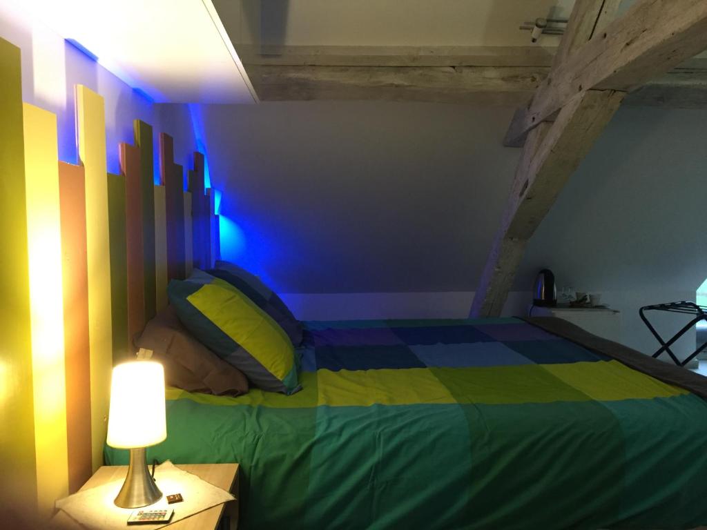 Postel nebo postele na pokoji v ubytování Chambre d’hotes Le Grand Fourneau