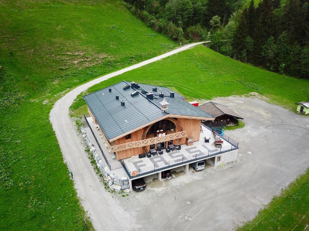 an overhead view of a large house with a porch at Ferienhaus Fassl in Saalbach Hinterglemm