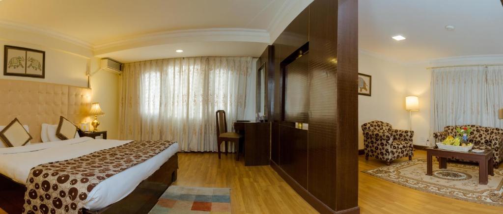 Postel nebo postele na pokoji v ubytování Hotel Vaishali