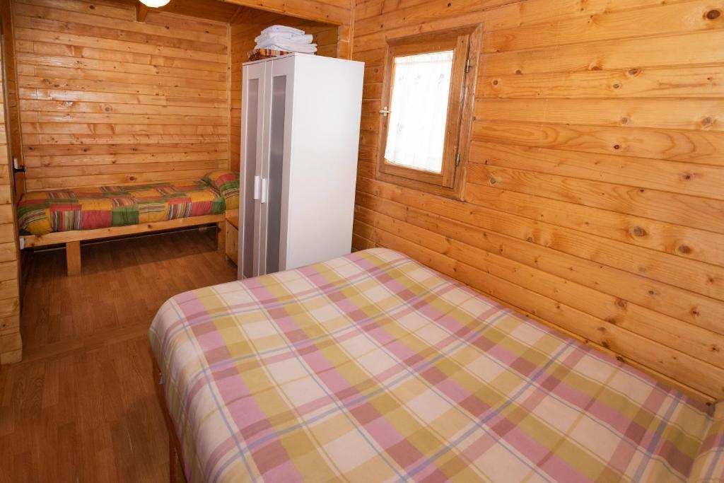 Postel nebo postele na pokoji v ubytování Cabañas Vallecino