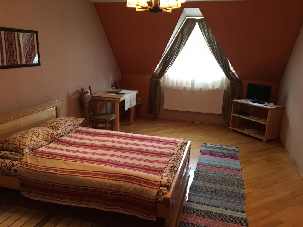 Postel nebo postele na pokoji v ubytování Hotel Svitlytsia