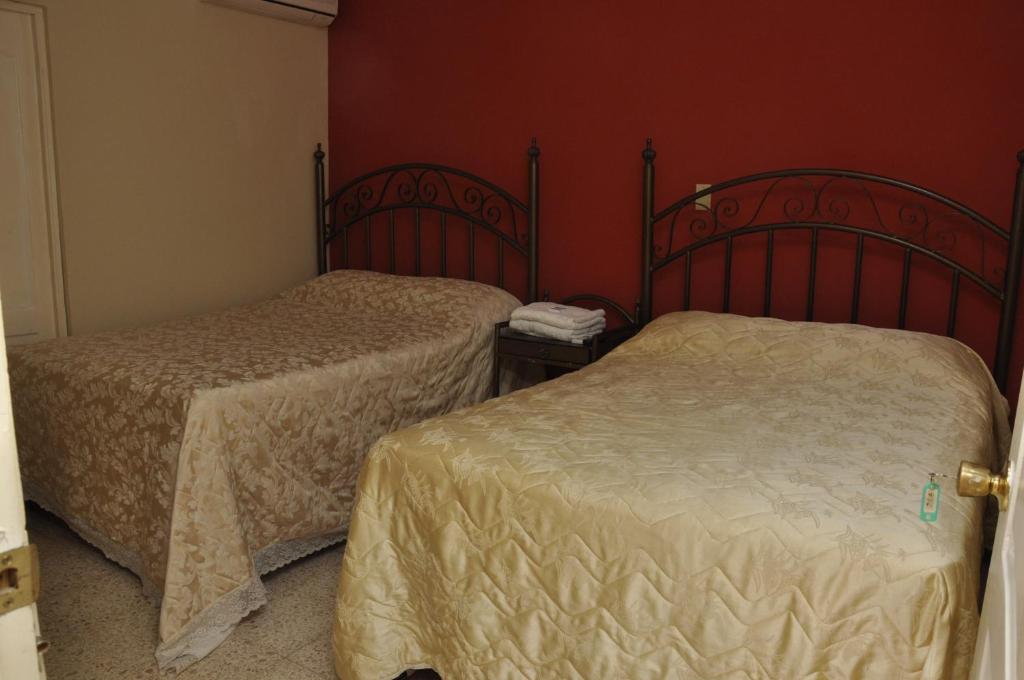 Postel nebo postele na pokoji v ubytování Hotel Colonial Blanco