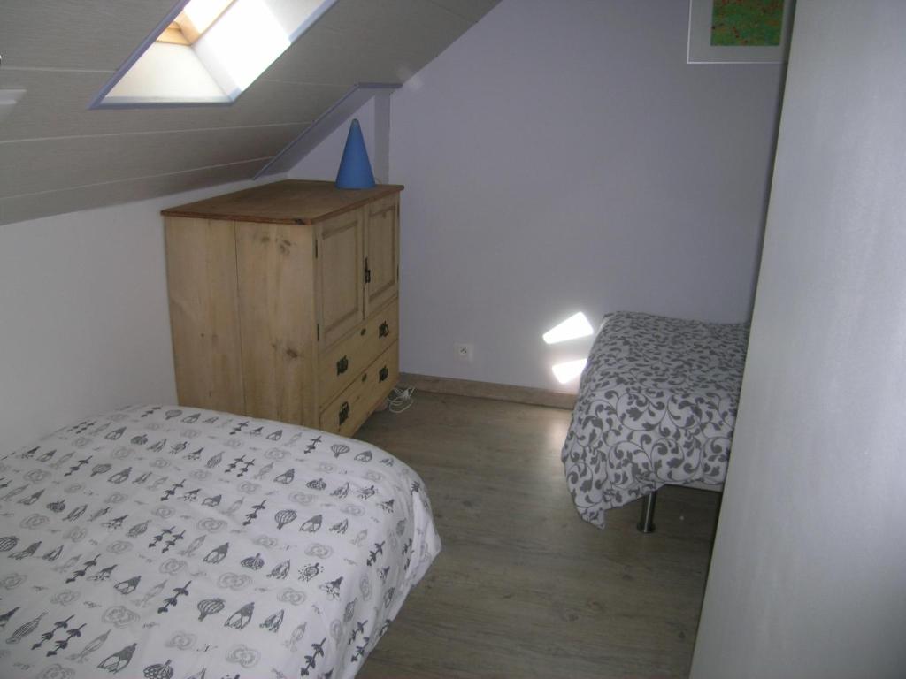Postel nebo postele na pokoji v ubytování Ti Gwen