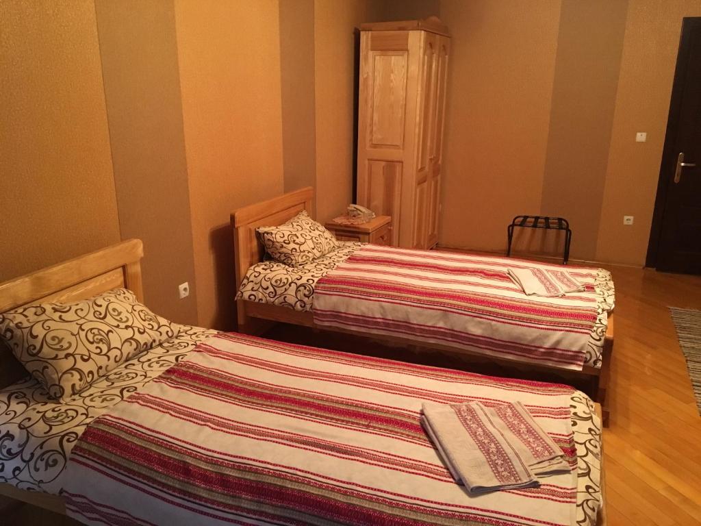 Postel nebo postele na pokoji v ubytování Hotel Svitlytsia