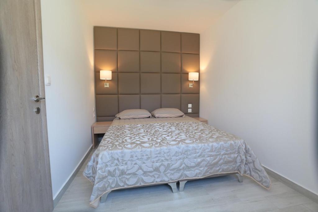 Posteľ alebo postele v izbe v ubytovaní Dionisos Resort