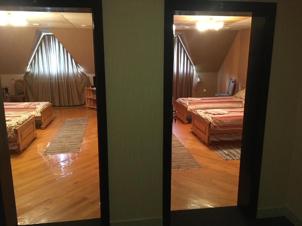 Postel nebo postele na pokoji v ubytování Hotel Svitlytsia