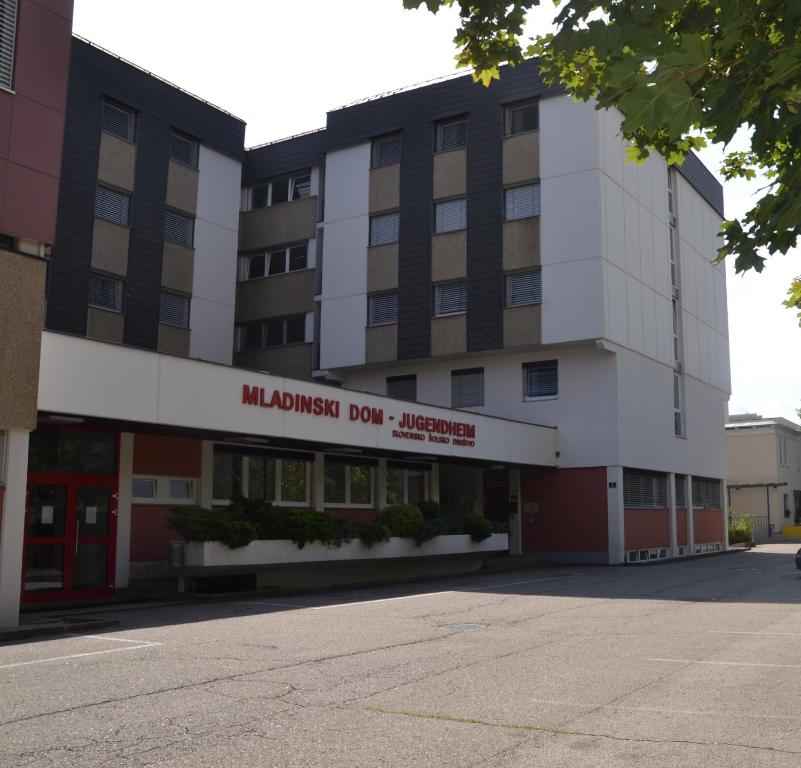 a large building with a million dollardar hospital at Mladinski dom - Hostel in Klagenfurt
