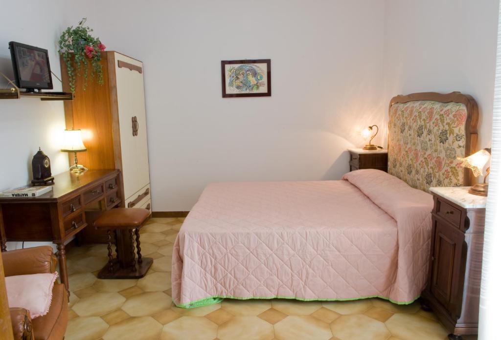 Postel nebo postele na pokoji v ubytování B&B Nova Siri
