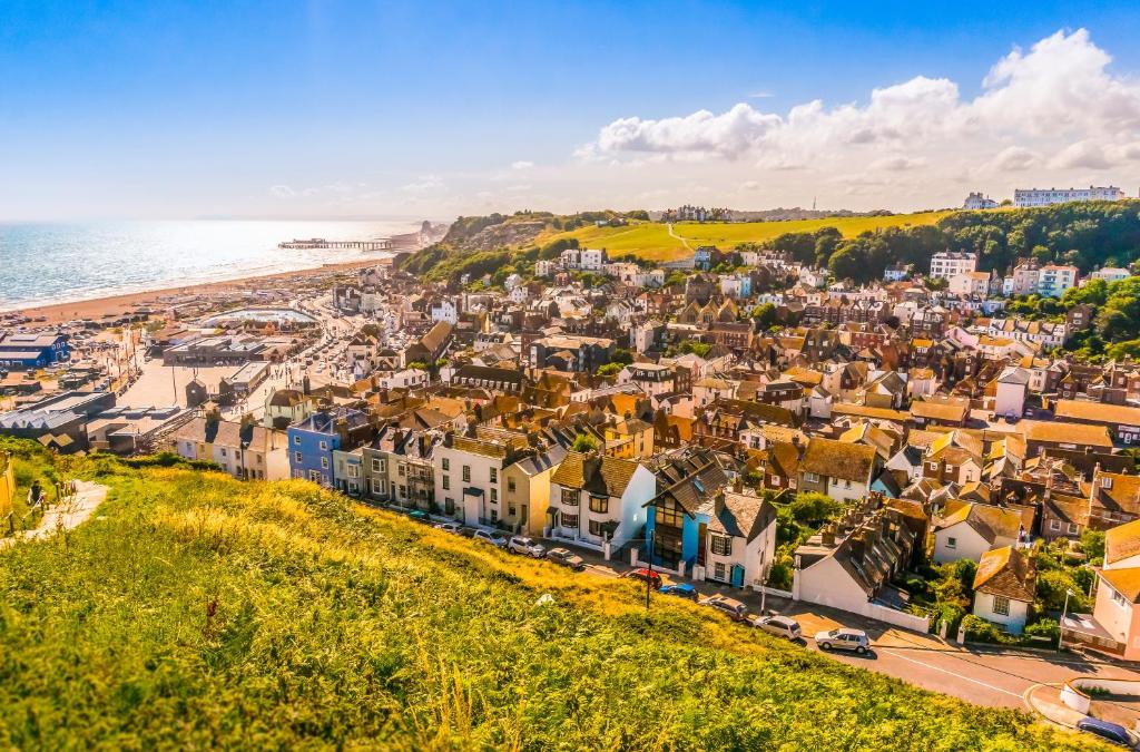an aerial view of a town next to the ocean at Sea View Holiday Flat - Covehurst Bay in Hastings