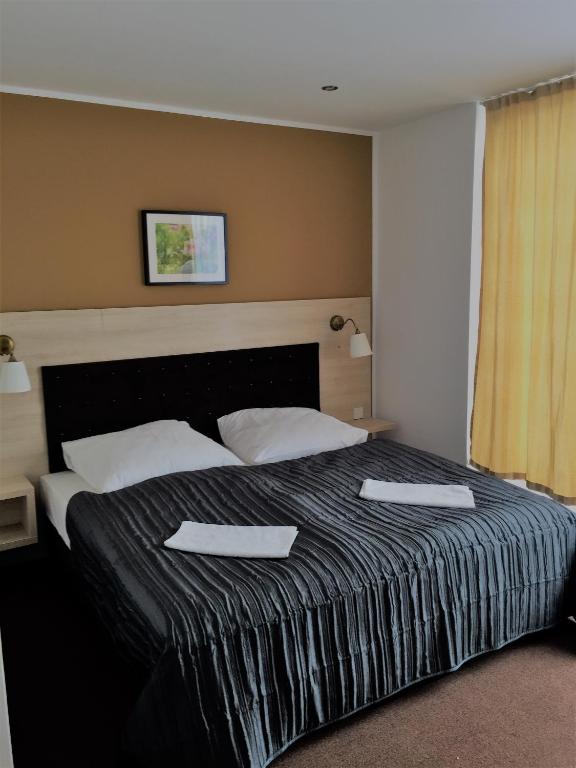 Postel nebo postele na pokoji v ubytování Hotel Denbu