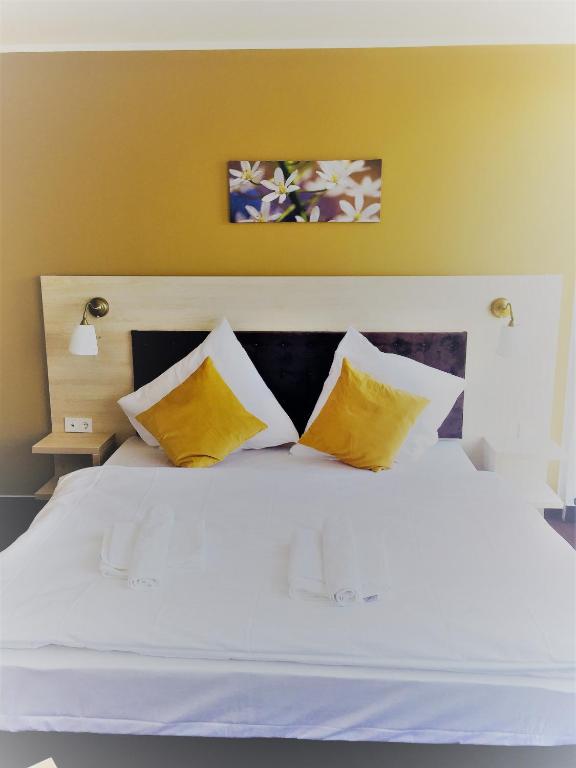 Postel nebo postele na pokoji v ubytování Hotel Denbu
