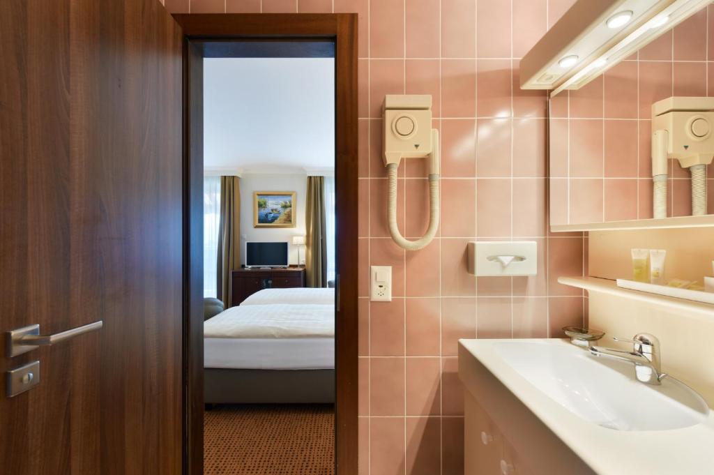Uma cama ou camas num quarto em Elite