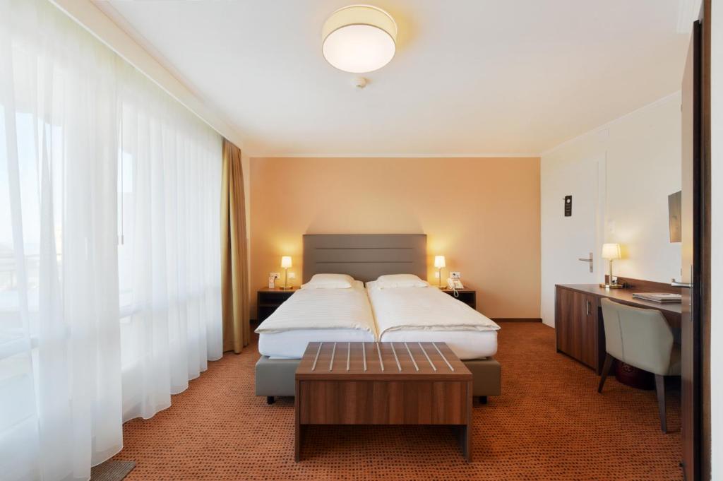 Uma cama ou camas num quarto em Elite