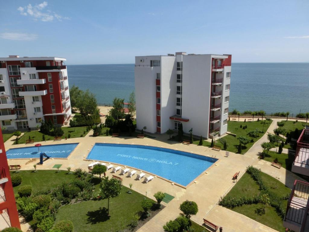 an aerial view of a building and a swimming pool at Sea View apartment, Panorama, Pools and beach, Sveti Vlas in Sveti Vlas