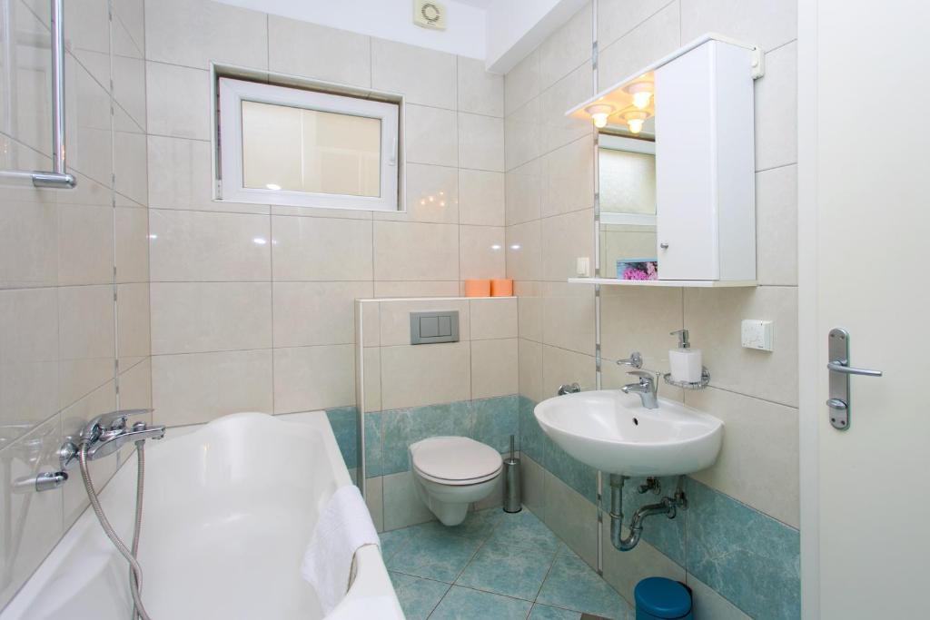 Kúpeľňa v ubytovaní Apartments Stipisic