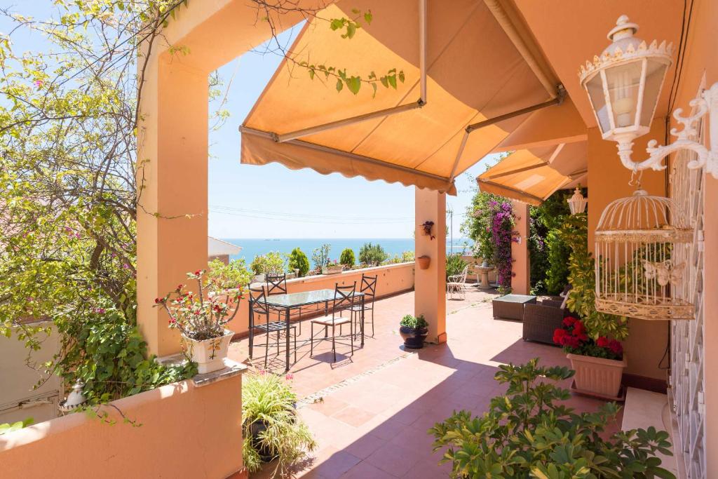 a view from the balcony of a house with a table and chairs at Villa Jarama in Málaga