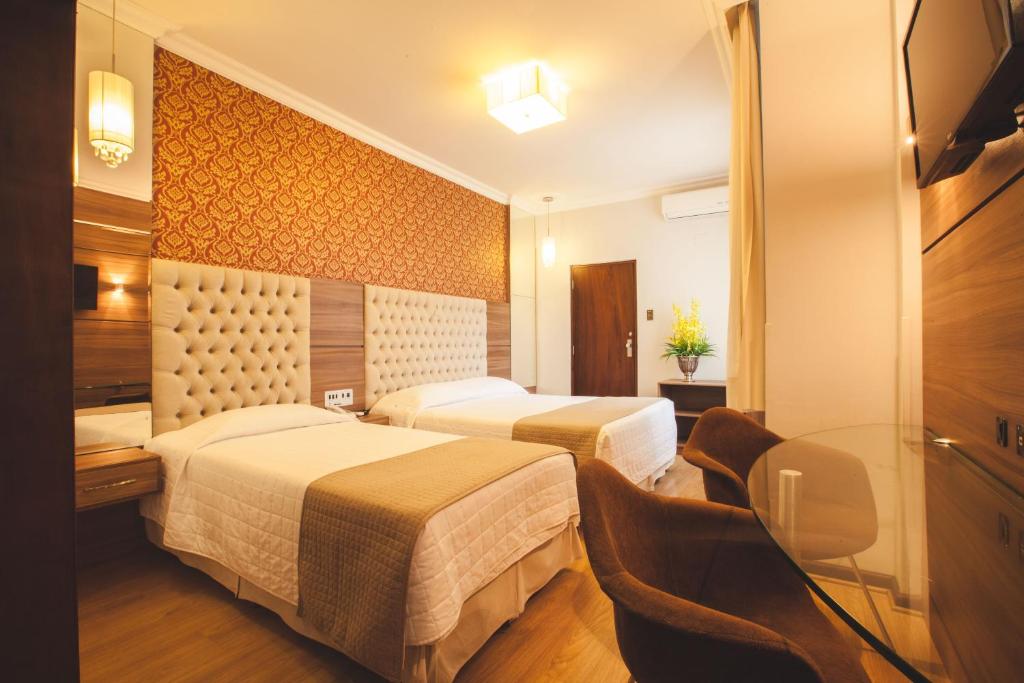 Cama o camas de una habitación en Curitiba Palace Hotel