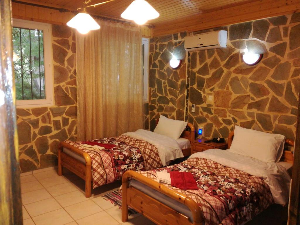 Postel nebo postele na pokoji v ubytování Apartments Zoumperi