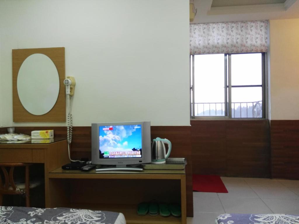 TV a/nebo společenská místnost v ubytování Qun Feng Hotel