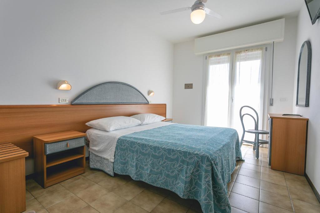 Postel nebo postele na pokoji v ubytování Hotel del Falco