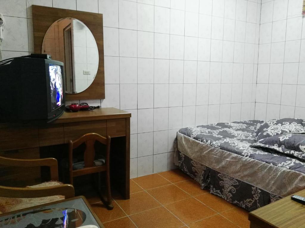 Postel nebo postele na pokoji v ubytování Qun Feng Hotel