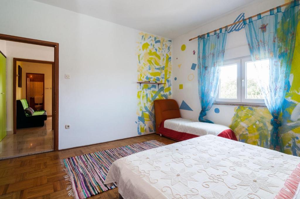 Postel nebo postele na pokoji v ubytování Apartments Cvita Ugljan