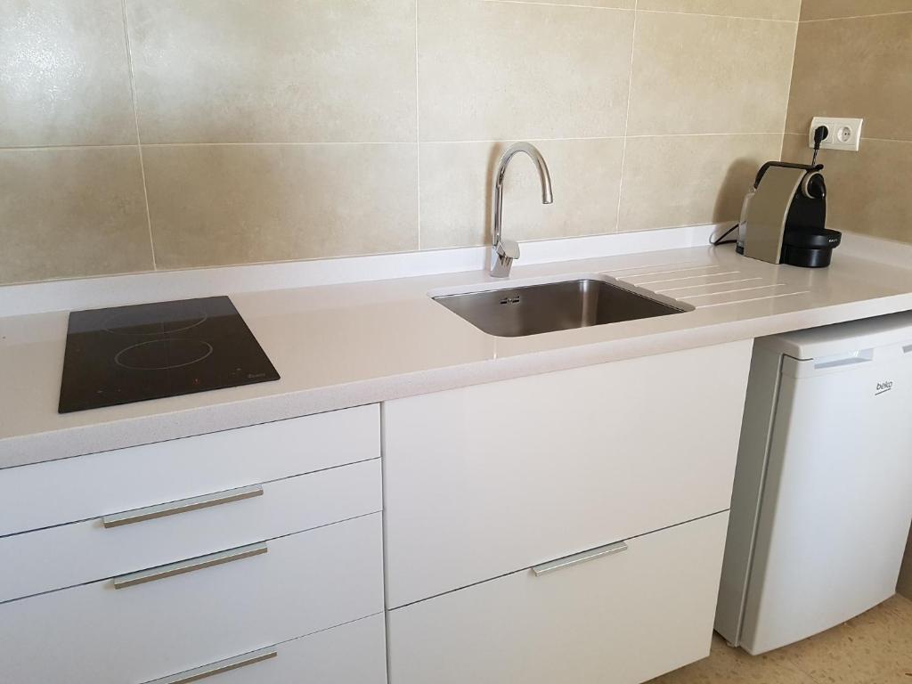 A kitchen or kitchenette at Viviendas Es Carritx