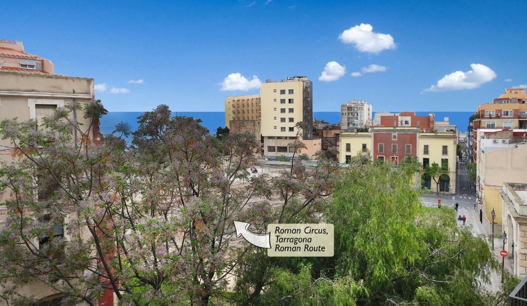 a view of a city with trees and buildings at Central with charm and sea views in Tarragona