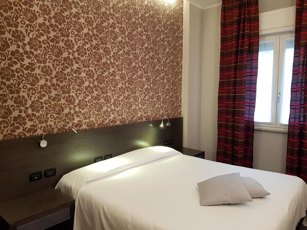 Postel nebo postele na pokoji v ubytování MA Hotel