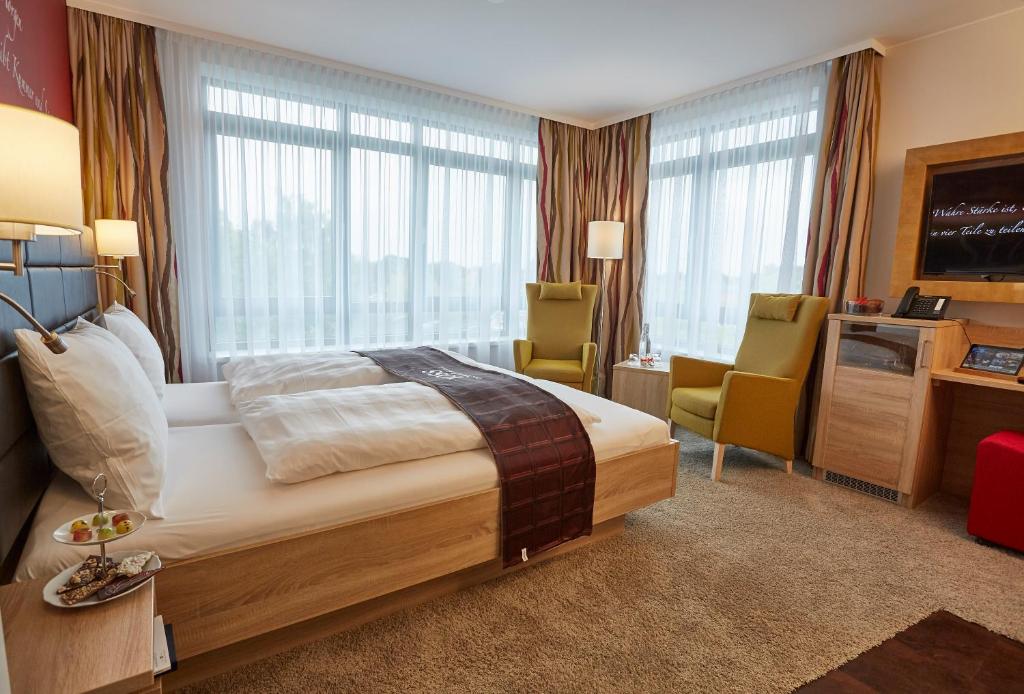 Postel nebo postele na pokoji v ubytování Das Schokoladenhotel