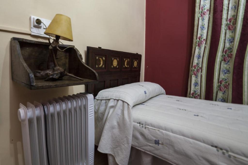 Postel nebo postele na pokoji v ubytování Casa Rural Calecha