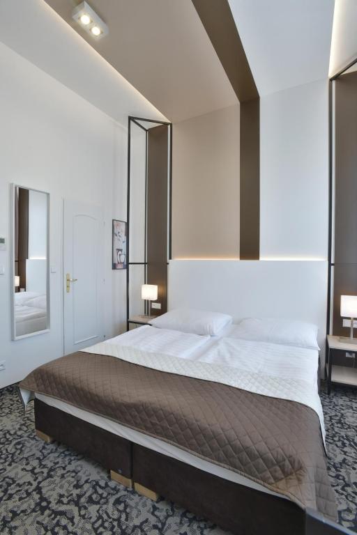 a bedroom with a large bed in a room at Máchova in Prague