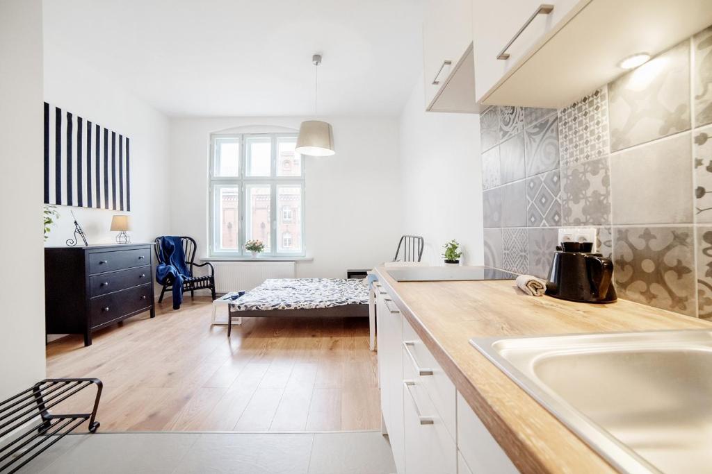 Giường trong phòng chung tại Apartament w Centrum Olsztyna